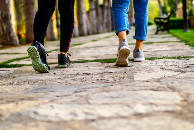 people walking outdoors enjoying the health and mood benefits of daily walking exercise